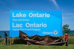 Ontario Premier Doug Ford, right, and Niagara West Member of Provincial Parliament Sam Oosterhoff unveil a sign for Lake Ontario at the Fifty Point Conservation Area in Grimsby, Ontario, Canada, on Saturday, Aug. 29, 2026.