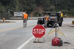 Authorities have set up checkpoints along roads to keep people away from the Chetco Bar Fire.