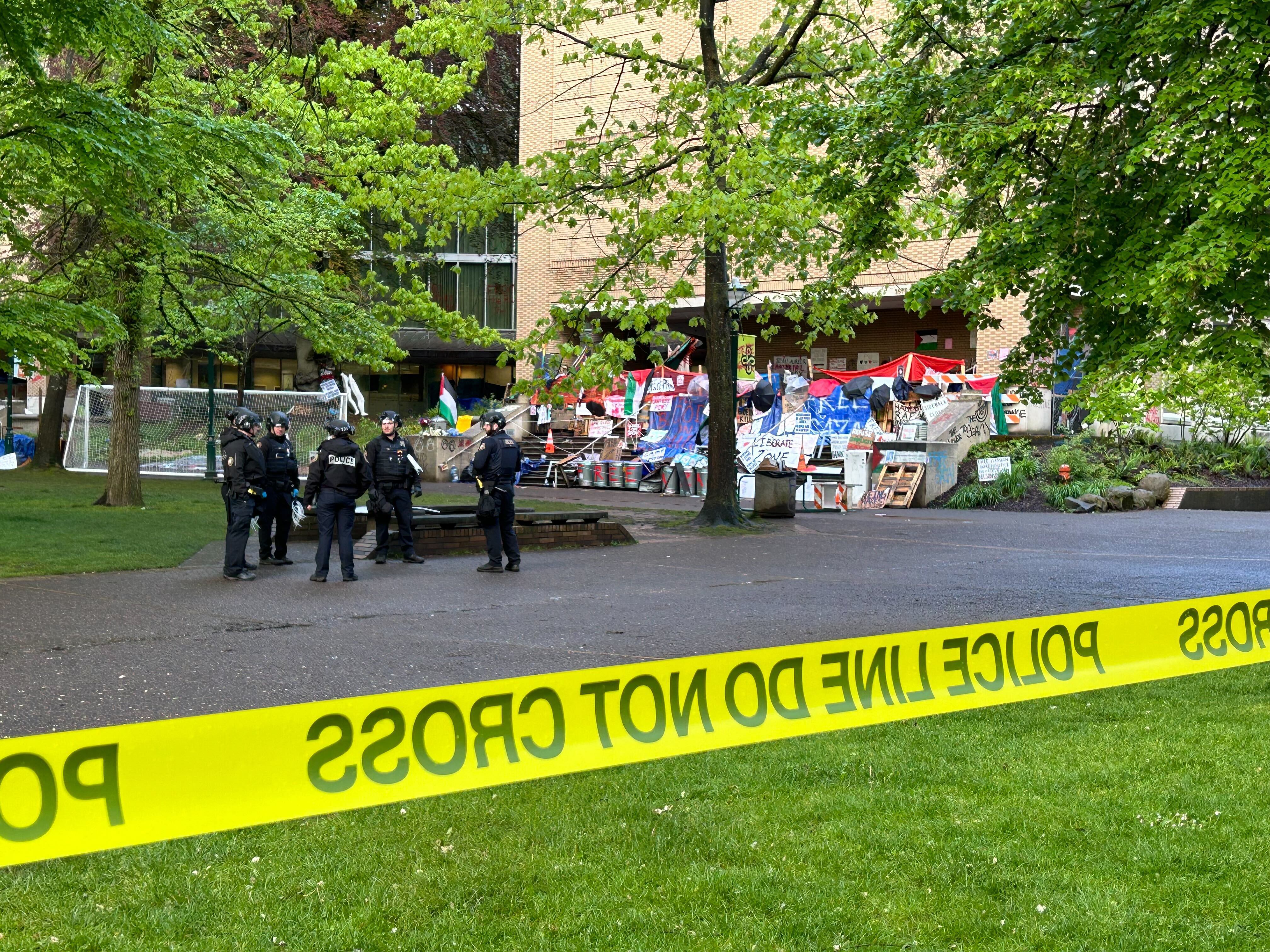 Police gather outside the Branford P. Millar Library at Portland State University in Portland, Ore., Thursday, May 2, 2024. People protesting Israel's role in the war in Gaza had occupied the library since Monday evening.