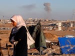 Smoke rises following an Israeli airstrike on buildings near the separating wall between Egypt and Rafah, southern Gaza Strip, on Monday.