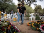 Mourners attend the funeral of Abraham Munder, 79, in Nir Oz, Israel.