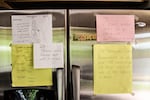 Health and wellness reminders posted on 99-year-old James Yamazaki's refrigerator door.