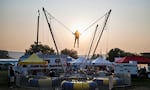 Haze from wildfire smoke hangs in the air as fairgoers attend the Crook County Fair in Prineville, Ore., on Aug. 5, 2026.