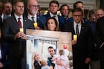 House Republicans display a photo of the Kirk family at a memorial event in the U.S. Capitol's Statuary Hall.