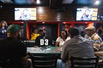 Randy Bruton plays in the poker tournament at the Hamilton Sports Bar.