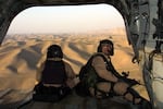 U.S. troops fly over northern Afghanistan in the early days of the war in 2001. The U.S. fought its longest ever war in Afghanistan, for 20 years, only to see the Taliban retake control of the country as the U.S. withdrew in 2021.