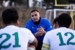 McKay head coach Juan Llamas talks to his players at halftime.