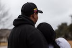 Juan and Marian, father and stepmother of Carlos, who was taken into custody by law enforcement and immigration officers a week after President Trump took office, stand for a portrait in Cedar Park, Texas, on Jan. 29, 2025.