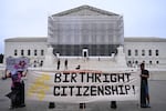 Demonstrators hold a sign reading "Hands Off Birthright Citizenship!" outside the Supreme Court on June 27, 2025. The Supreme Court did not rule on President Trump's controversial executive order, but it did limit lower courts' ability to block executive actions with universal injunctions.