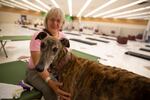 June Sanders and her adopted greyhound Rudy stay cool at an old Rite Aid store in North Portland on Aug. 11, 2021. Multnomah County converted the building into a cooling shelter.