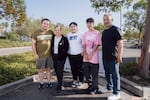 The Leal family, from left: Aaron, Maria, Evelyn, Isaac and David pose or a portrait outside of the Rancho Santa Margarita Library in Orange County on Monday, Oct. 27, 2025. Gabriella Angotti-Jones for NPR