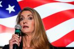 In this Nov. 13, 2020, file photo Republican candidate for U.S. Senate Sen. Kelly Loeffler speaks at a campaign rally in Cumming, Ga. Loeffler’s tight embrace of President Donald Trump and the far right while fighting to hold on to her U.S. Senate seat is not exactly what allies of Georgia Gov. Brian Kemp envisioned when he appointed her to the position in 2019.