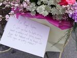 Flowers and a letter to the Princess of Wales were left outside Windsor Castle on Saturday.