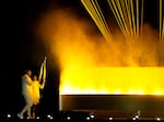 The cauldron is lit by torch bearers Marie-Jose Perec and Teddy Riner in Paris, France, during the opening ceremony of the 2024 Summer Olympics, Friday, July 26.