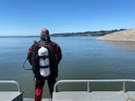 In this supplied photo, a Multnomah County Sheriff's Office diver prepares to enter the Columbia River on June 27, 2022. Search and rescue teams were searching for a missing swimmer after he jumped in the river to help a person struggling in the water.