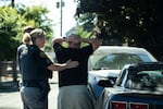 After interrupting a “car date,” Sergeant Kristi Butcher and Officer Hughes prepare to gather information from the person of interest during a directed patrol mission in Northwest Portland in July.