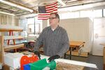 David Springer helps assemble energy efficient window inserts at the Portland company Indow on March 16, 2020. "A lot of the office people aren't here," he said, "But we have to be here to make the product."