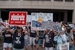 People attend a protest hosted by activists near the Washington, D.C. Metropolitan Police Department Headquarters on Friday.