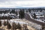 Highway 20 cuts east across Bend, Ore., from Pilot Butte on Thursday, Jan. 28, 2021. A pilot project will allow the city of Bend to develop residential property in some commercial areas.