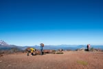 Hikers stand atop Tam McArthur Rim outside Bend, Ore., Friday, Sept. 24, 2021.