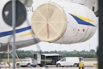 Police forensic technicians work near a Ukrainian aircraft at Leipzig/Halle Airport, where a drone with an explosive device was found and a detonator was removed from the object, in Schkeuditz, Germany, Wednesday Aug. 5, 2026.