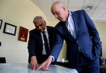 Aruni Bhatnagar (from left) and Ted Smith, researchers at the University of Louisville's Christina Lee Brown Envirome Institute, point to the areas in the city where their team is planting trees.