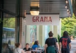 Customers sit at tables outside of Grana Pizza Napoletana in Portland, Ore., Aug. 9, 2024. Grana saw a 100% increase in sales from May to June 2024 after being included in the 50 Top Pizza U.S.A. list.