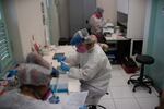 Researchers work in a state-run Fiocruz Institute laboratory at Pedra Branca state park, near Rio de Janeiro, Brazil, Tuesday, Oct. 29, 2020. Their goal is to identify other viruses that may be highly contagious and lethal in humans, and to use that information to devise plans to stop them from ever infecting people.