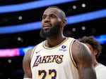 Los Angeles Lakers forward LeBron James looks toward fans after scoring during the second half of an NBA basketball game against the Denver Nuggets Saturday, March 2, 2024, in Los Angeles.