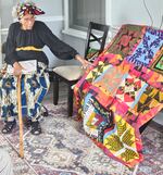 Edith Edmunds, 99, pictured with one of her completed Underground Railroad Code quilts.