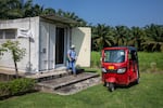 Cecilia González and Damaris Sanchez leave the lab in a tuk-tuk to head into the community for a research project.