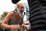 Half marathon finishers receive their medals at the finish line in downtown Portland.