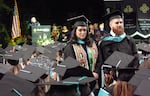 Students turn their back to Portland State University President Ann Cudd during the university's 2024 commencement ceremony. The protests follow a weekslong demonstration, demanding the university divest from companies that support Israel.