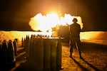 An Israel Defense Forces artillery unit fires towards Gaza near the border on December 11, 2023 in Southern Israel. Israel's AI system can be used to send targets to forces on land, air and sea.