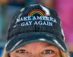 Corrine Knutson watches the Pride parade in downtown Portland, Ore., on July 19, 2026. The parade started near the North Park Blocks and moved along Northwest Davis Street to Naito Parkway, ending at a waterfront festival.