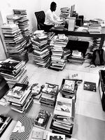 Staff members at the Dikan Center sort and label books in June 2022 as they prepared for the library's opening at the end of the year.