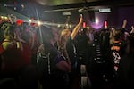 More than 100 people gathered to remember actor Tim Curry at the Clinton Street Theater in Portland, Ore. on August 26, 2026. They brought flowers, dressed in drag and shared stories about the actor’s impact on them.