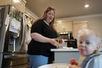 Christin Shapiro feeds her son Jori before taking him to daycare at Little Kits in Bend, Ore., on June 3, 2026.