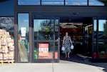 Debbie Taylor exits Grocery Outlet in Madras, Ore. Taylor said her family ran out of milk the night before and the store in Madras is the nearest one that carries the brand she buys.