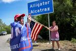Rena Mourer (left) and Dianna Mourer take pictures at the entrance to "Alligator Alcatraz" at the Dade-Collier Training and Transition Airport on July 12, in Ochopee, Florida.
