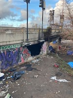 The scene of a fire in Portland on Wednesday, March 8. In the course of responding to the fire, crews found that people had been living inside the structure at the base of the Steel Bridge.