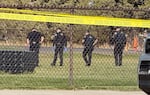 Law enforcement crews search the field behind Silver Rail Elementary School, in Bend, Ore., Oct. 15, 2026. A shooting occurred at the school, leaving multiple victims, including children, officials say.