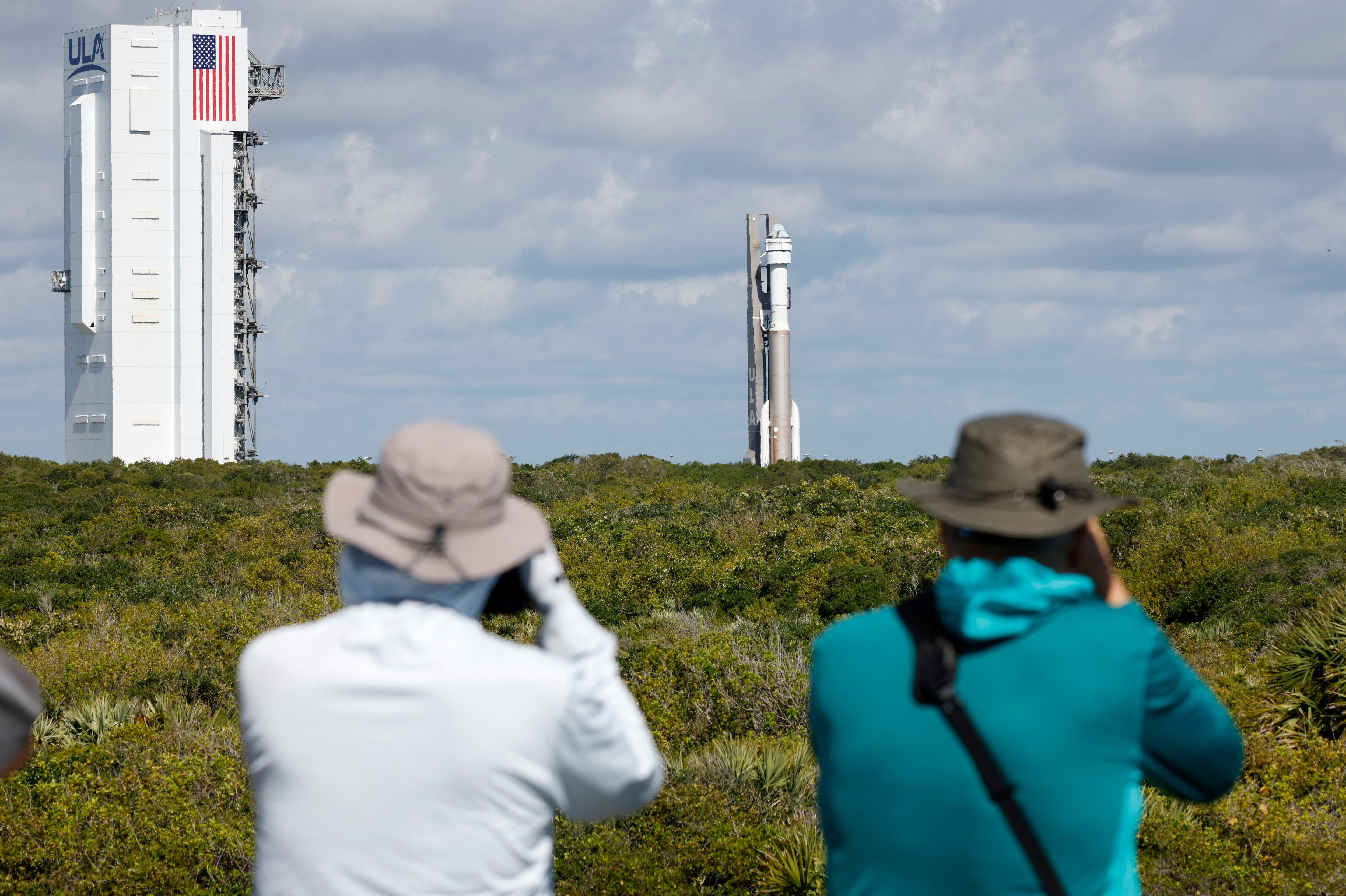 Photographers capture the Boeing Starliner capsule atop an Atlas V rocket as it is rolled out to the launch pad at Space Launch Complex 41, Saturday, May 4, 2024, in Cape Canaveral, Fla.