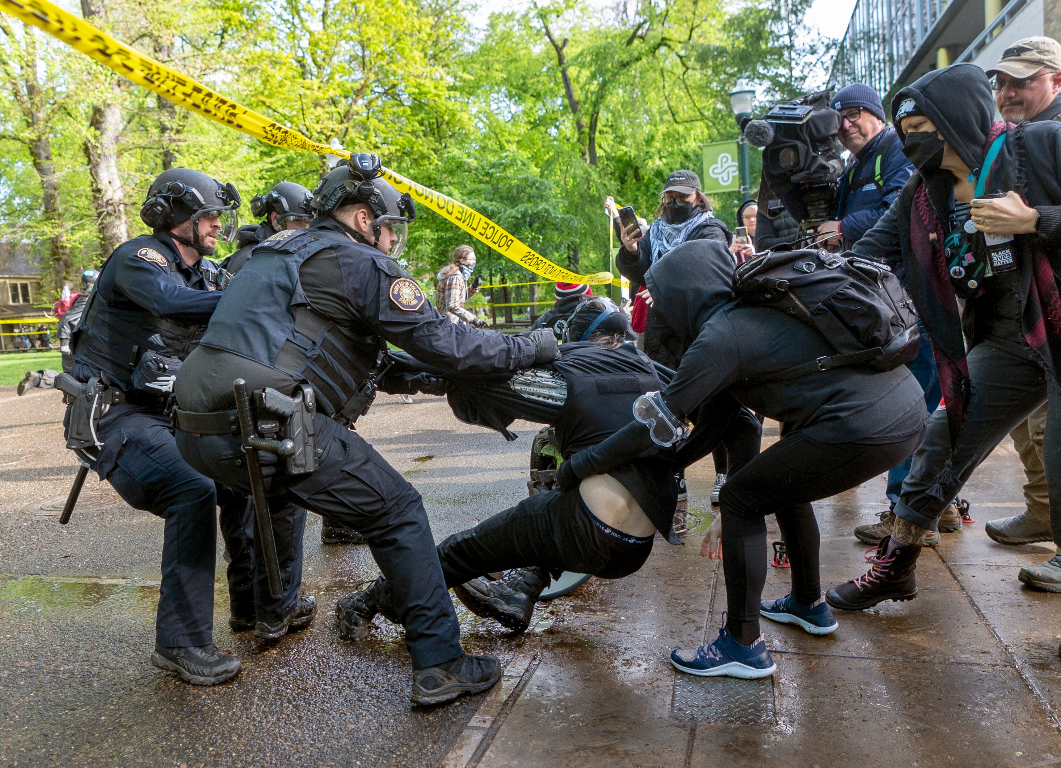 Police detain and arrest a person who attempted to escape Portland State University’s Branford Price Millar Library, May 2, 2024. People protesting Israel's role in the war in Gaza had occupied the library since Monday evening.