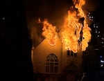 Flames are seen erupting from the former Portland Korean Church in Portland on Tuesday, Jan. 3, 2023.