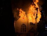 Flames are seen erupting from the former Portland Korean Church in Portland on Tuesday, Jan. 3, 2023.