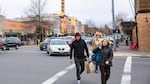 Pedestrians cross a street in downtown Bend, Oregon, on Friday, March 17, 2017. Growth, development and changing traffic patterns have prompted city officials to reduce speed limits on several key arteries around the city. 