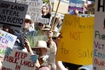 Hundreds of people protest efforts to privatize federal public land in Santa Fe, N.M., outside a meeting of governors from western states and top Trump-administration officials, as Agriculture Secretary Brooke Rollins announced plans to rescind a decades-old rule that blocked logging on national forest lands, in Santa Fe, N.M., Monday, June 23, 2025.