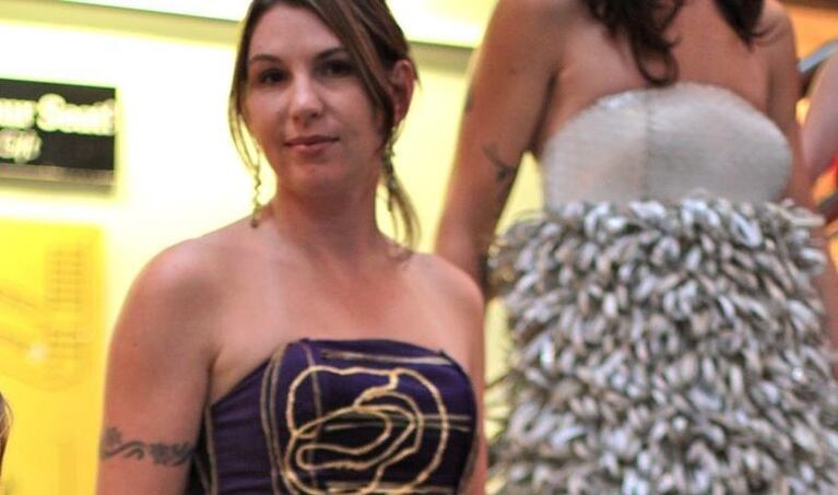 Shaunna Sutcliffe is looking regal draped in more than 500 Crown Royal whiskey bags stitched into a floor-length ball gown.