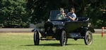 author Ian McCluskey takes a turn behind the wheel of a Model T at WAAAM.